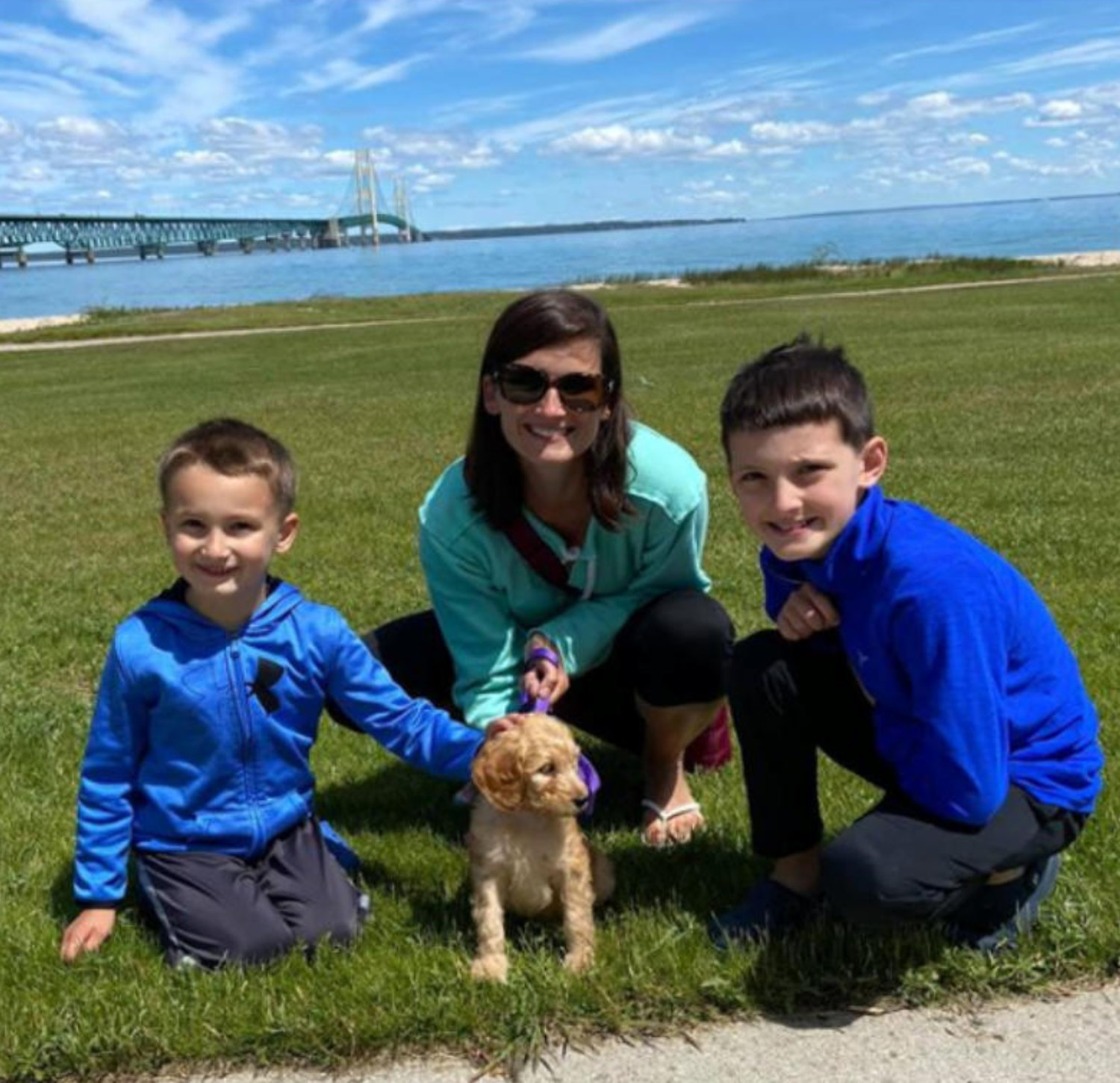 Mom with two boys and new puppy